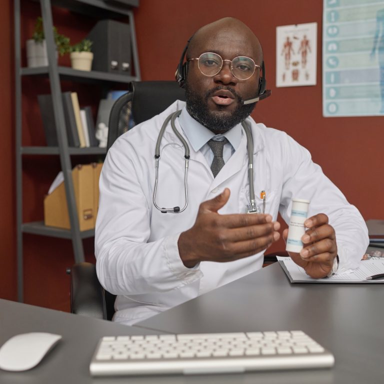 doctor-prescribing-medicine-to-his-patient-during-2024-01-29-18-25-16-utc (1)